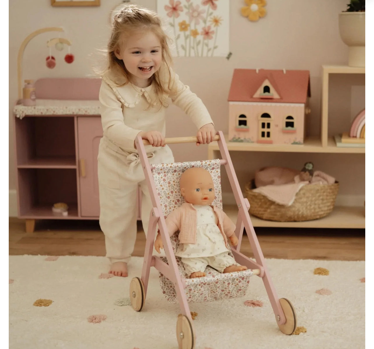 عرباية الدمى باللون الزهري